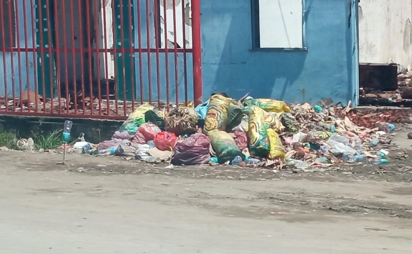 Mixed waste piled beside a road